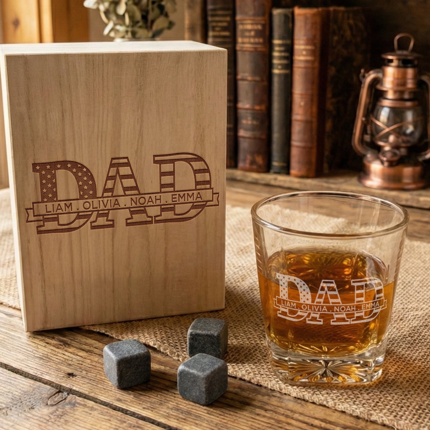 Personalized whiskey glass and wooden gift box for dad with engraved names, whiskey stones nearby