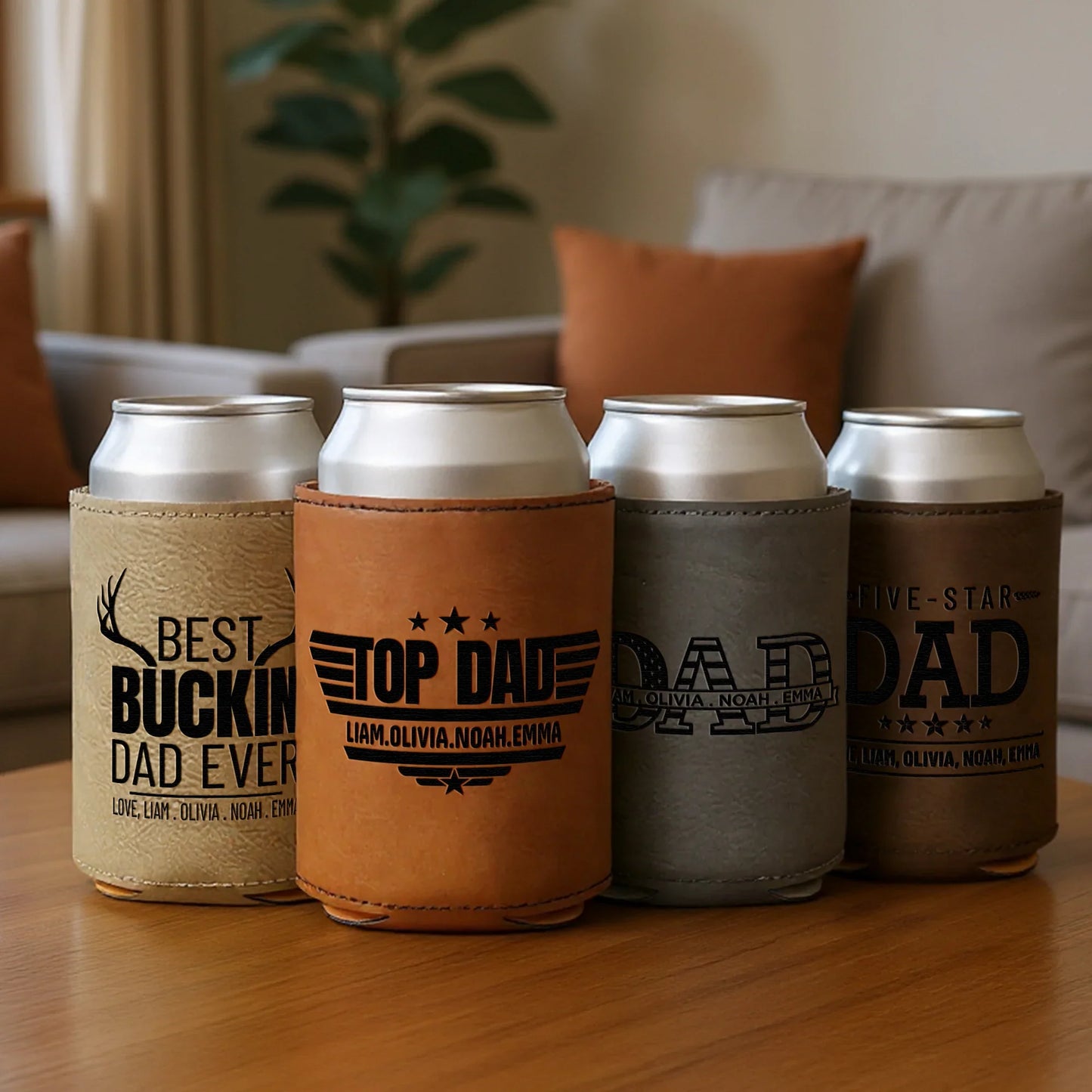 Personalized leather can coolers for dad with engraved messages on a coffee table in a cozy living room.