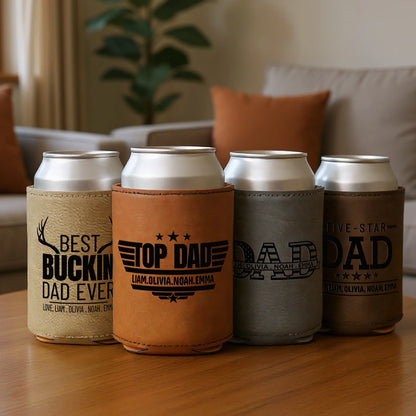 Personalized leather can coolers for dad with engraved messages on a coffee table in a cozy living room.